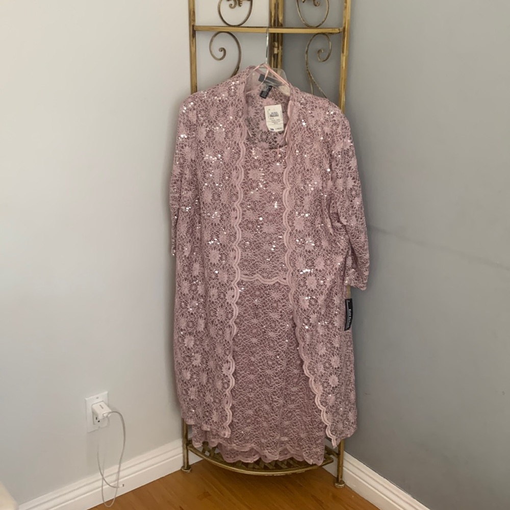 Pretty dress with coat has never been worn and in great condition